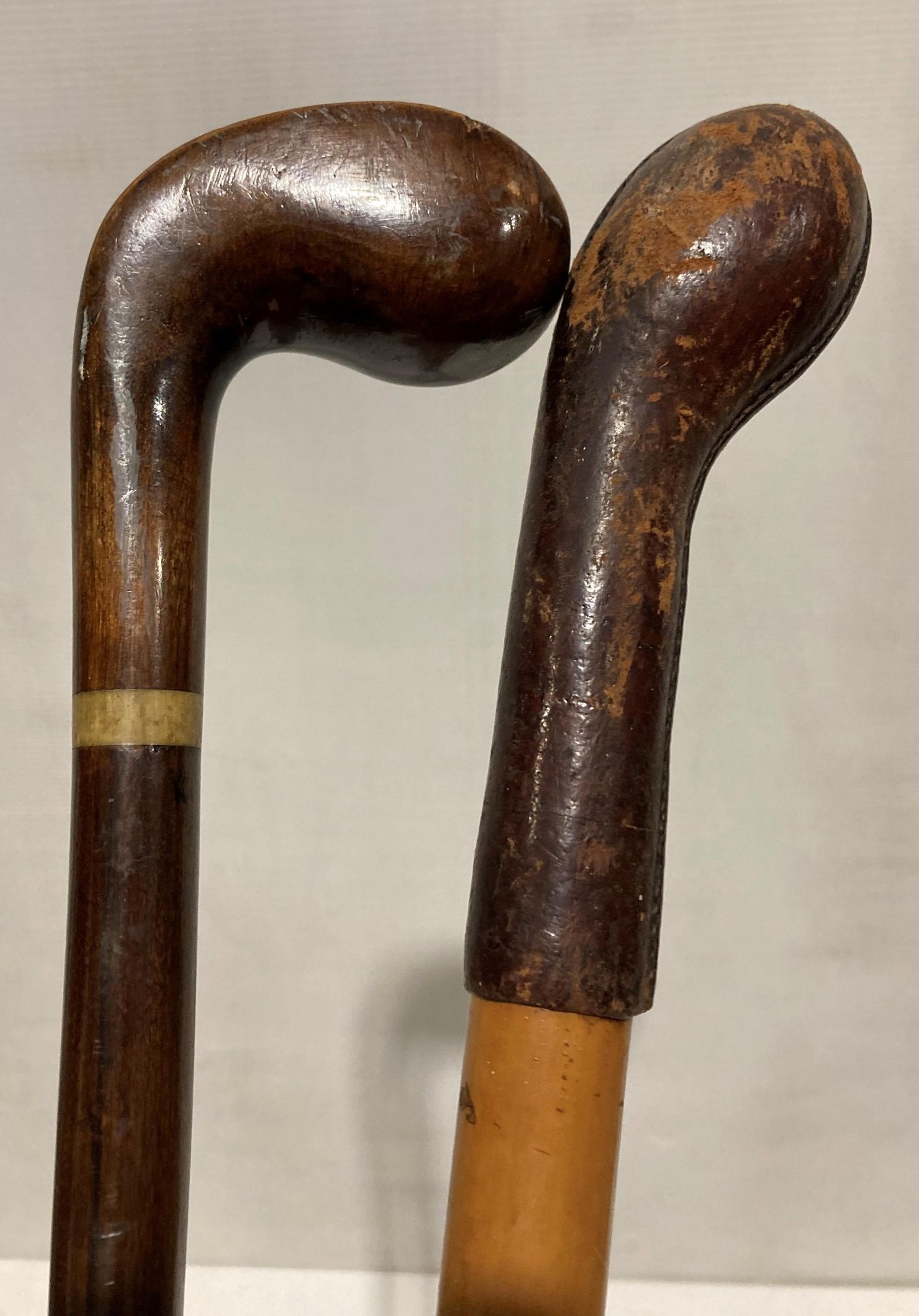 Two wooden walking sticks - one with leather bound handle (93cm long) and a right hand walking - Image 2 of 2
