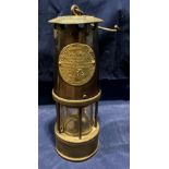 A brass and metal miners lamp by The Protector Lamp and Lighting Co Ltd, Eccles, Manchester,