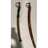 Two assorted Indian made replica military sabre swords and scabbards with brass handles (Saleroom