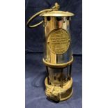 A brass and metal miner's lamp by 'The Protector Lamp and Lighting Co', type 6, Eccles,