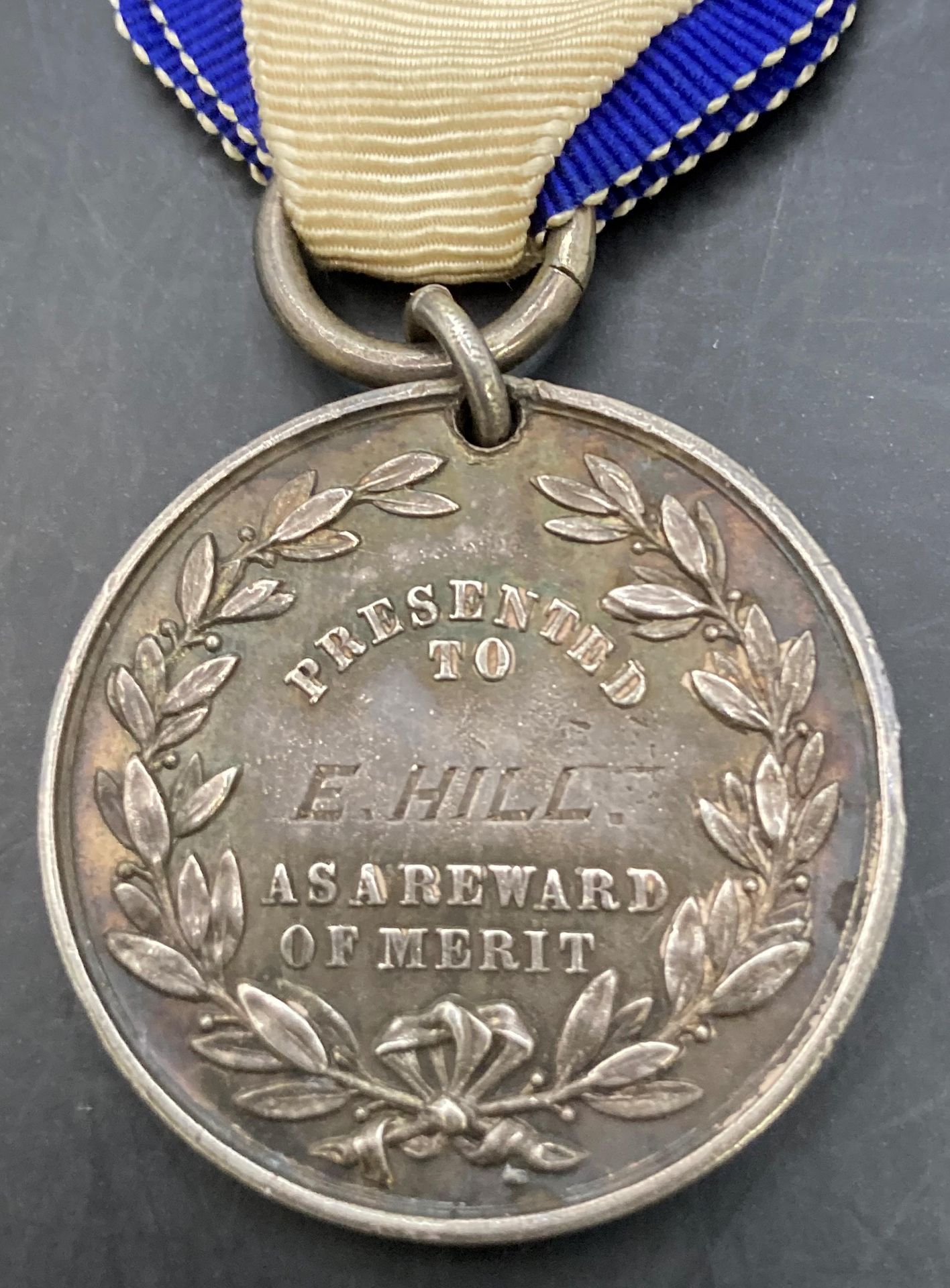HMS Warspite Royal Naval Training Ship Medal as a Reward of Merit in silver. - Image 2 of 2