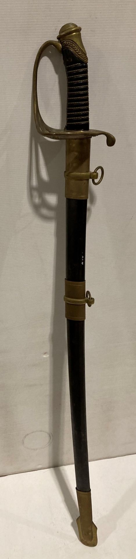 A reproduction Confederate Cavalry Officer's sword with CSA etched blade and CS to brass handle