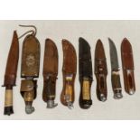 Eight assorted horn/resin handled hunting knives,