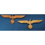 Two Nazi Party brass badges (Saleroom location: S3 GC1)