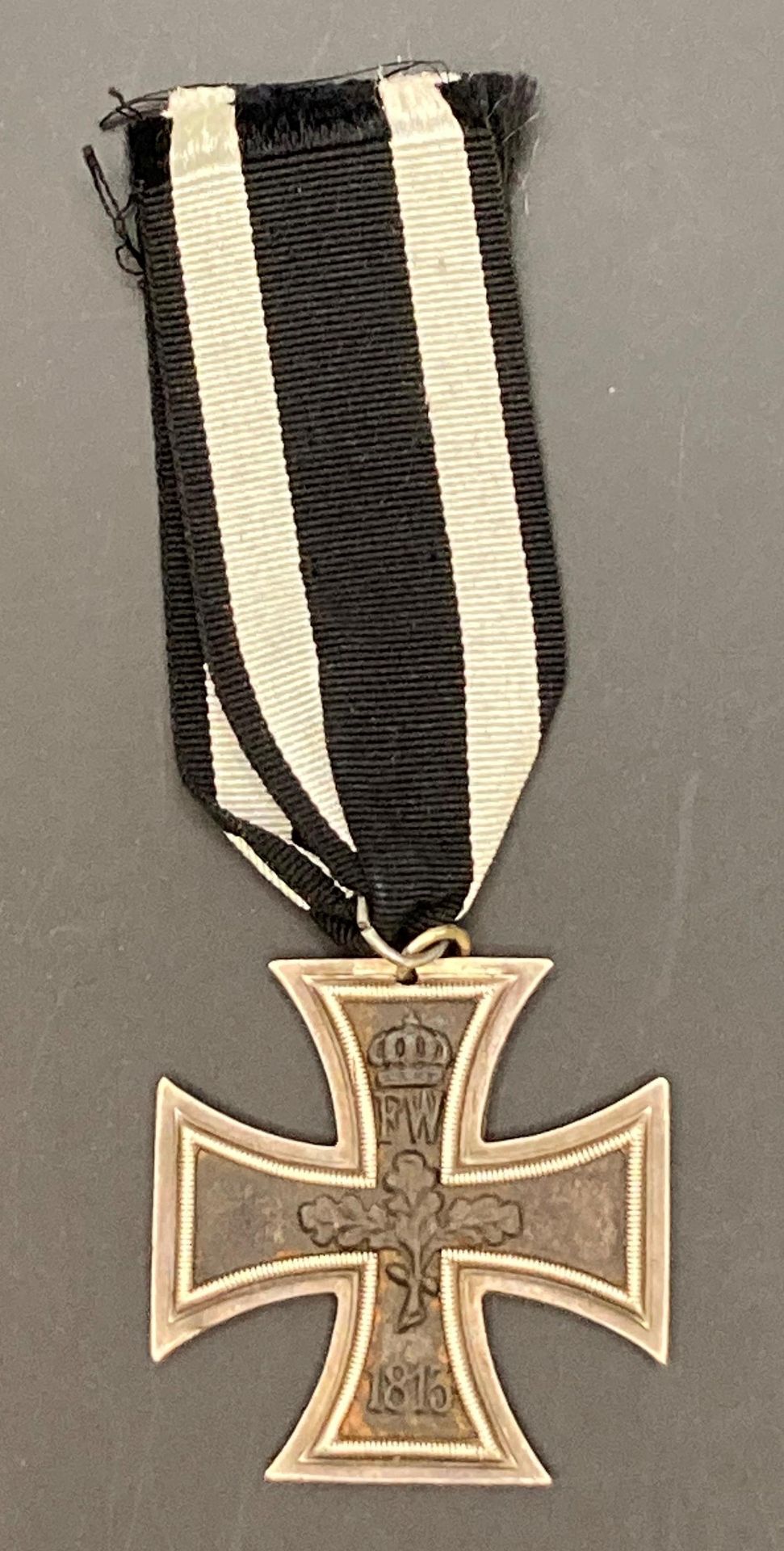 A German World War I iron cross 2nd class with ribbon (Saleroom location: S3 GC4)