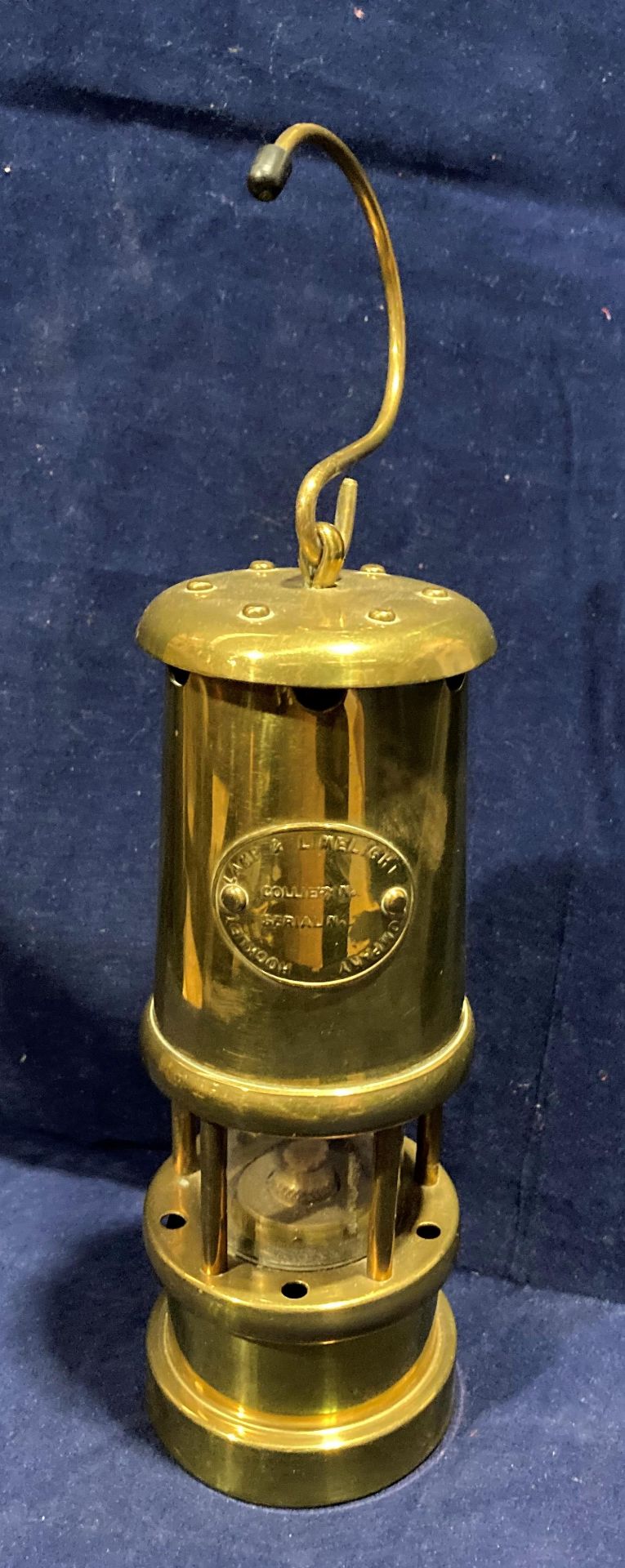 A small brass model miner's lamp with name plate Hockney Lamp and Limelight Company,