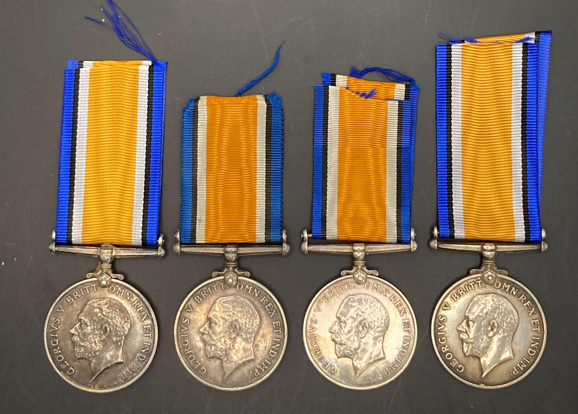 Four World War I War Medals with ribbons to 77032 Gnr B Green R A,