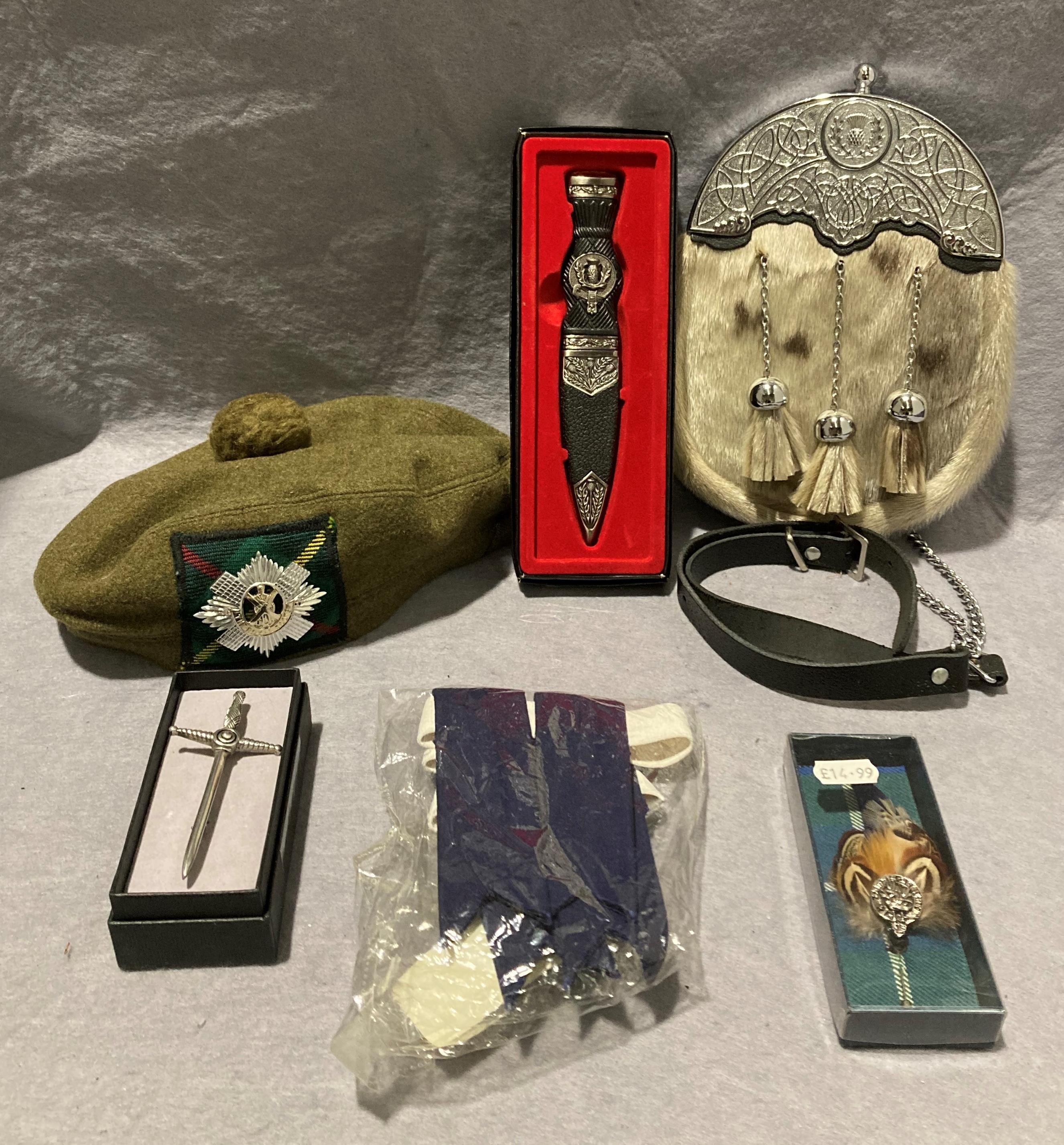 Contents to box - a Greenland seal and real leather Scottish sporran, sword kilt pin,