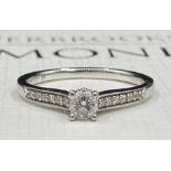 A 9ct white gold diamond solitaire ring,