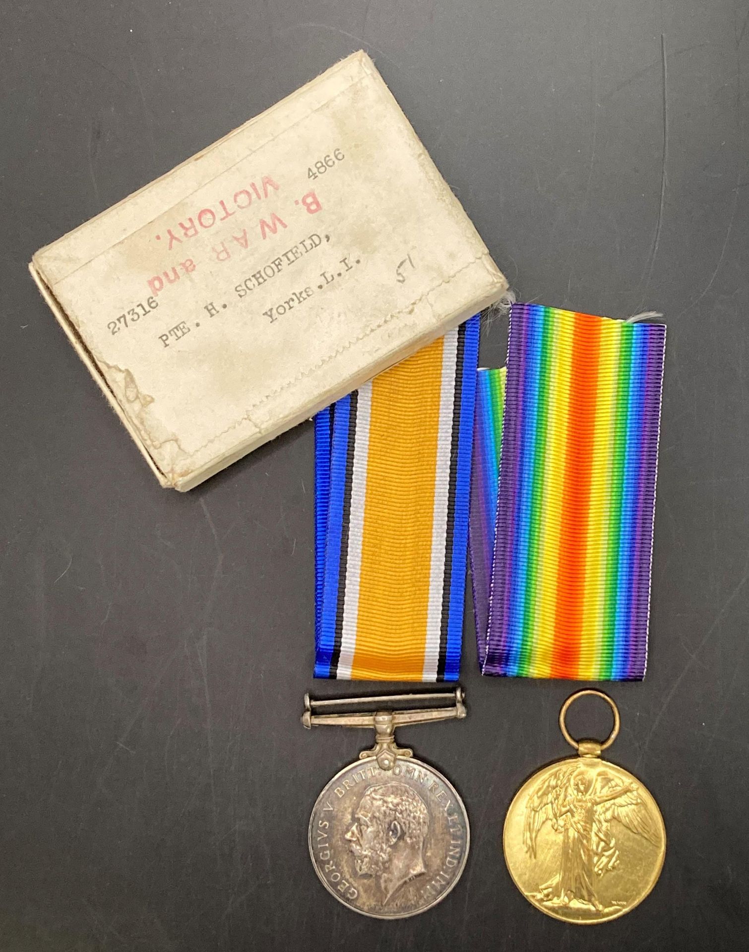 Two First World War medals - War Medal and Victory Medal complete with ribbons and with box of