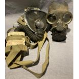 Vintage Puretha type C respirator face mask dated 16 Jun 1960 and a British WW2 civilian duty gas