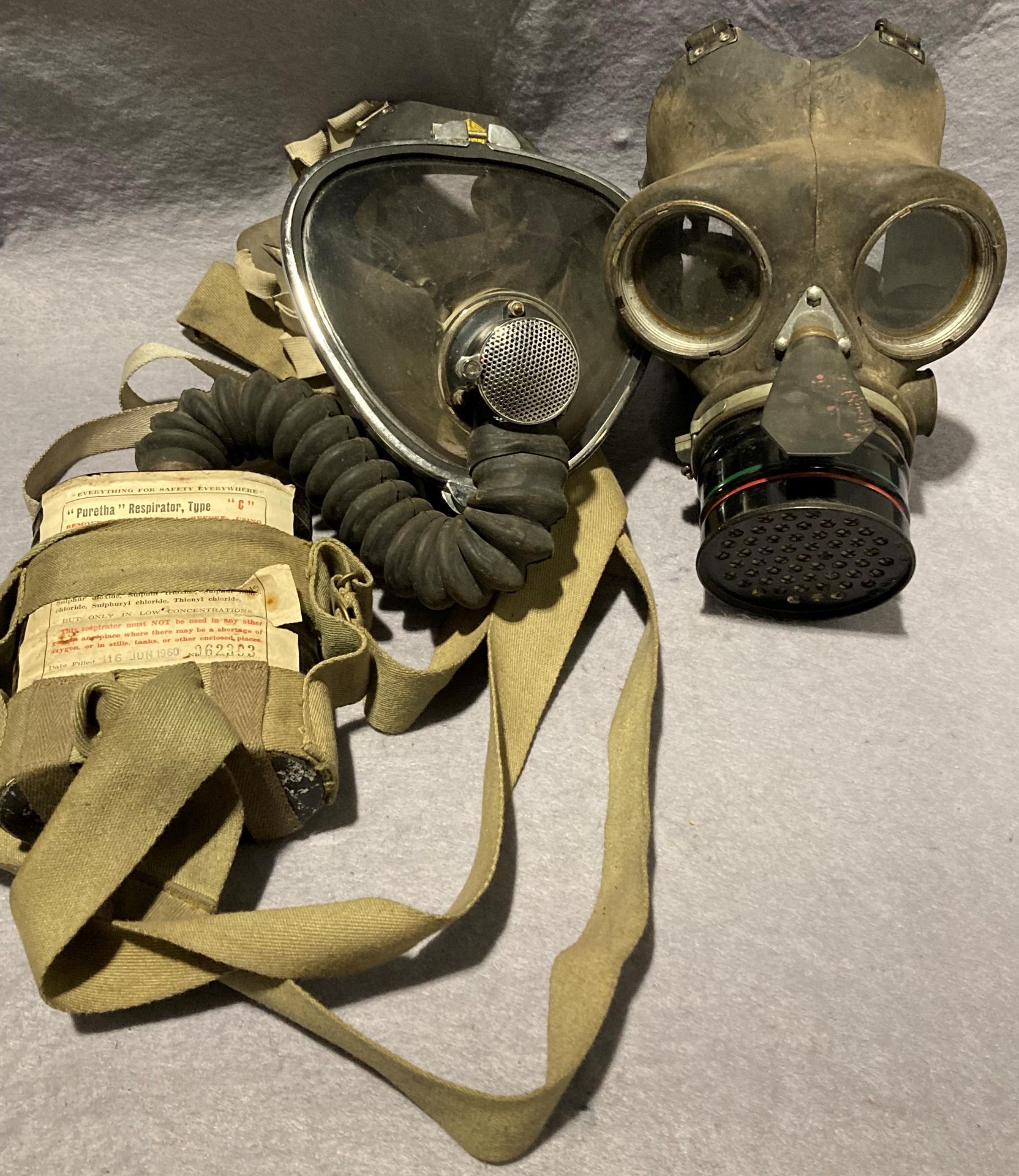 Vintage Puretha type C respirator face mask dated 16 Jun 1960 and a British WW2 civilian duty gas