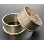 Two hallmarked silver napkin rings engraved with all postings from 1923 to retirement in 1961 and