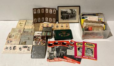 Contents to two boxes - 15 cigarette card booklets and two tins of assorted cigarette cards,