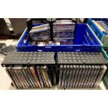 Contents to blue plastic crate - approximately 68 DVDs etc.