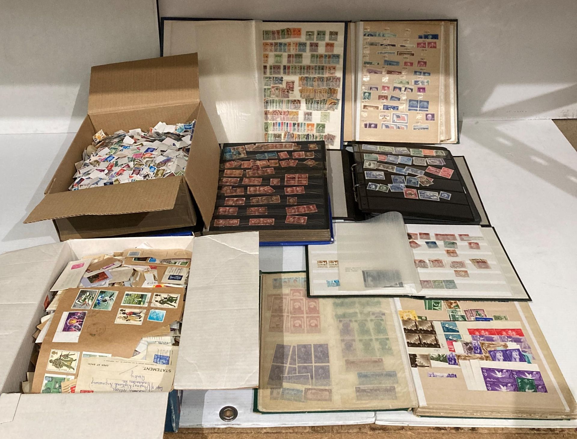 Contents to box - six assorted stamp albums/books and two boxes of mainly UK loose stamps (Saleroom