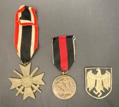 Two German Medals - 1939 Merit cross with swords and ribbon and 1st October 1938 Nazi Germany