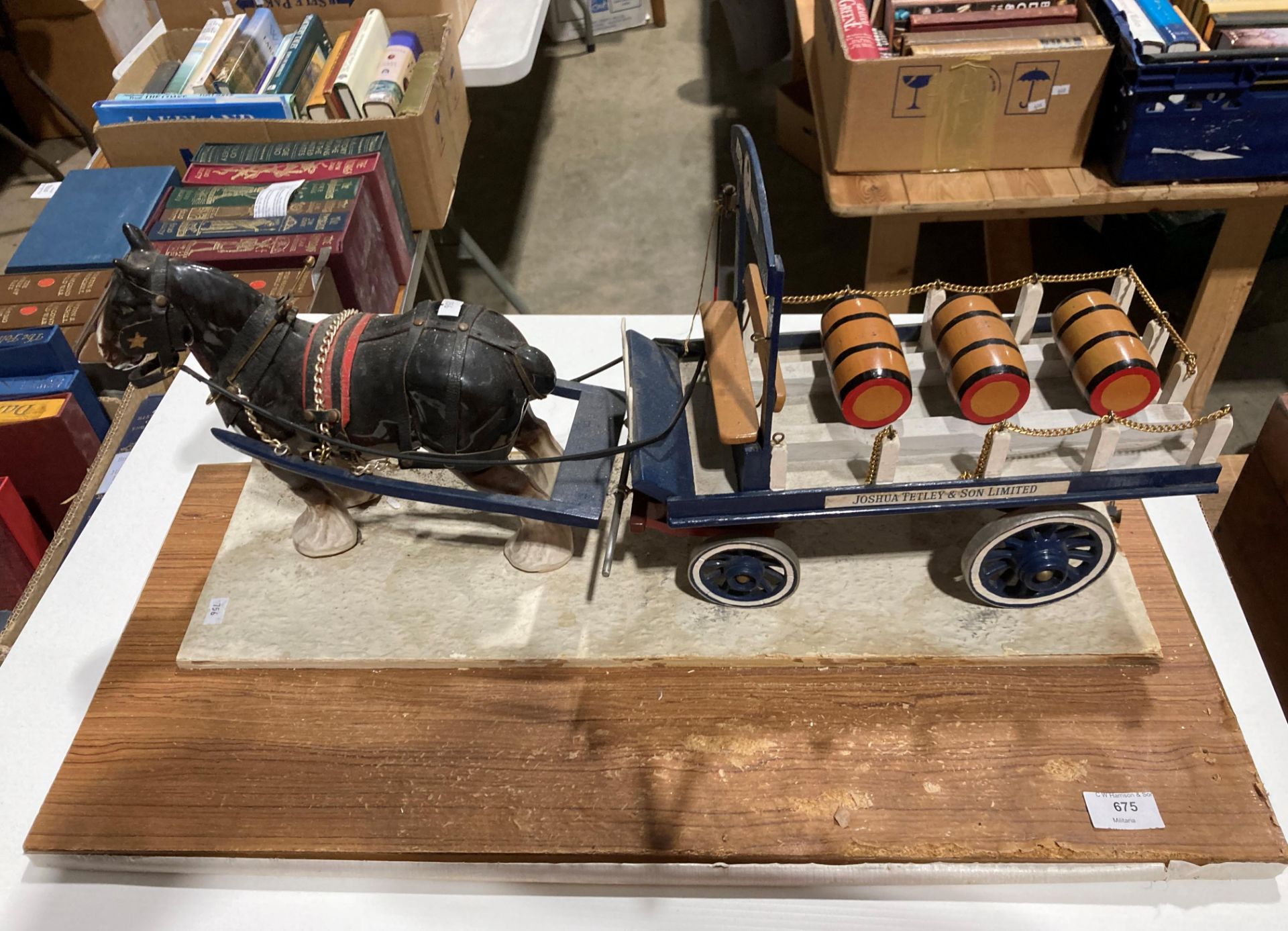 A wood scale model of a Joshua Tetley & Son Ltd dray cart being pulled by a pottery shire horse,