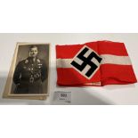 A German Second World War Swastika arm-band and a photograph of a German officer annotated to rear