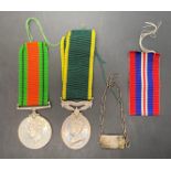 1939-1945 War Medal together with ribbon, ribbon for the 1939-1945 defence medal,