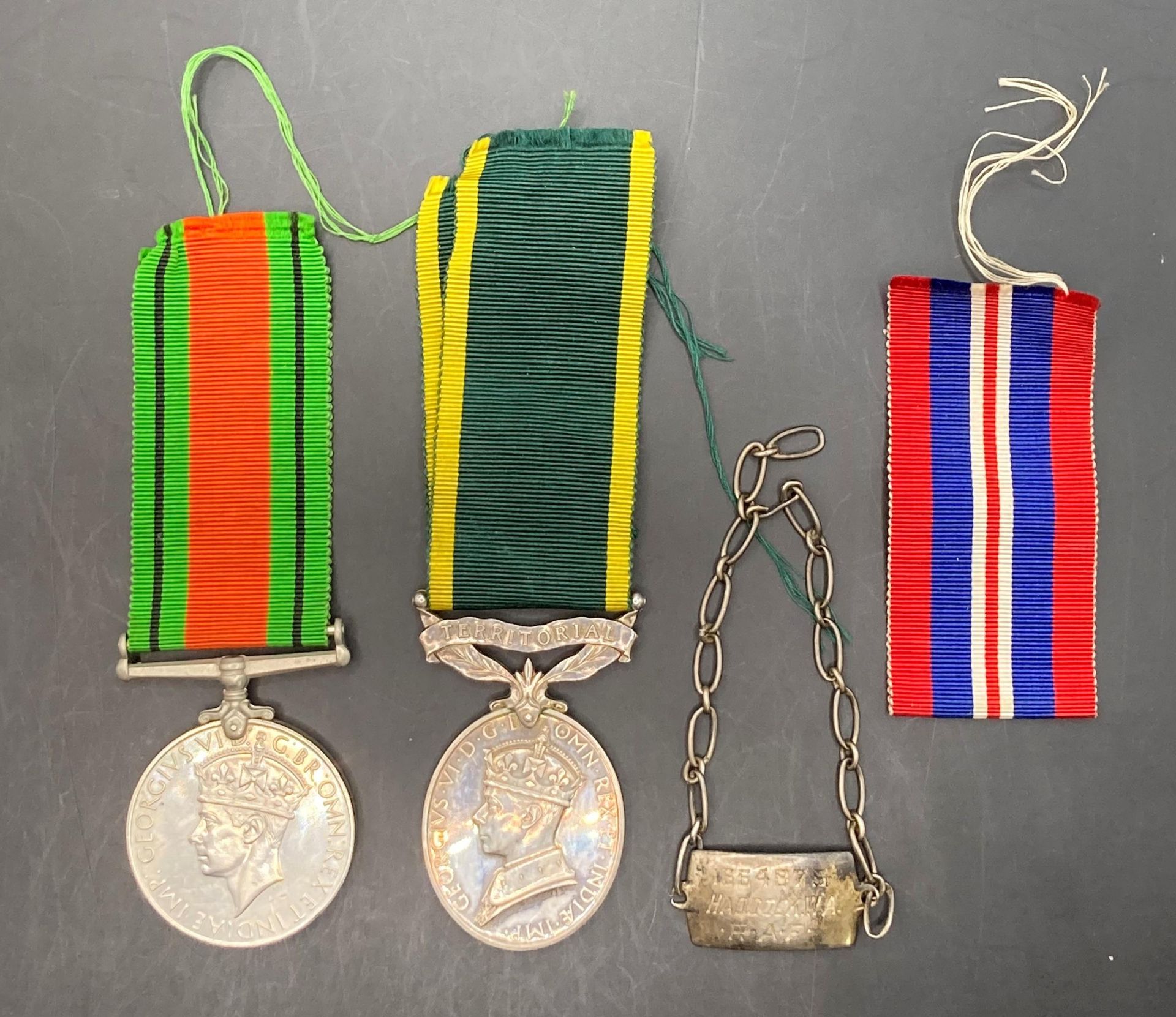 1939-1945 War Medal together with ribbon, ribbon for the 1939-1945 defence medal,