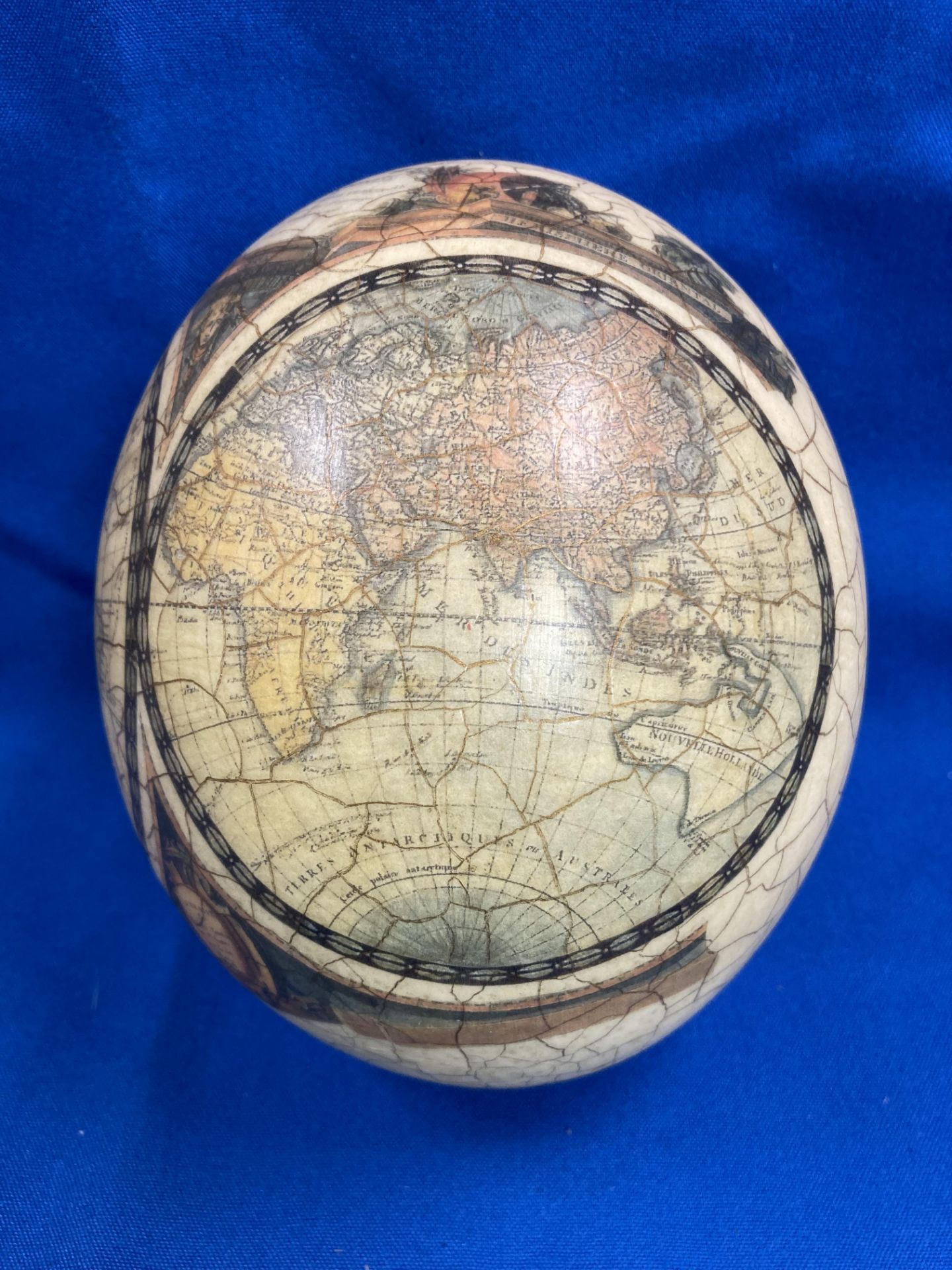 A decorated ostrich egg with World Map and Africa animal scene (approximately 16cm high) with a - Image 7 of 11