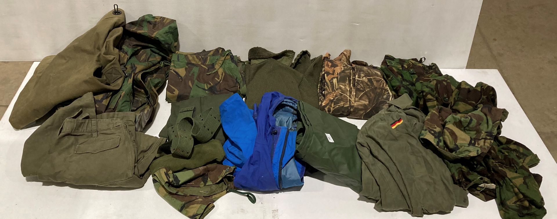 15 assorted military clothing items including kit bag combat DPM trousers (76/96/112) and smock