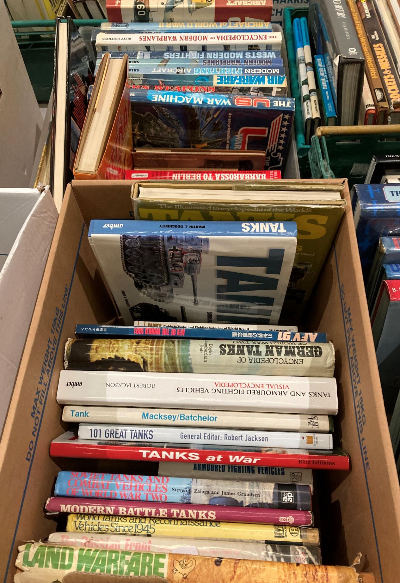 Contents to two boxes - approximately 35 assorted books on tanks, war machines, air warfare,