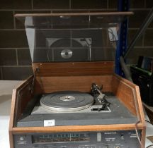 A Dynatron stereo radio with Garrard SP25 Mk IV record deck (flex cut off,