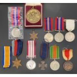Six Second World War Medals - the 1939-1945 Star with ribbon, the Africa Star, two 1939-1945,