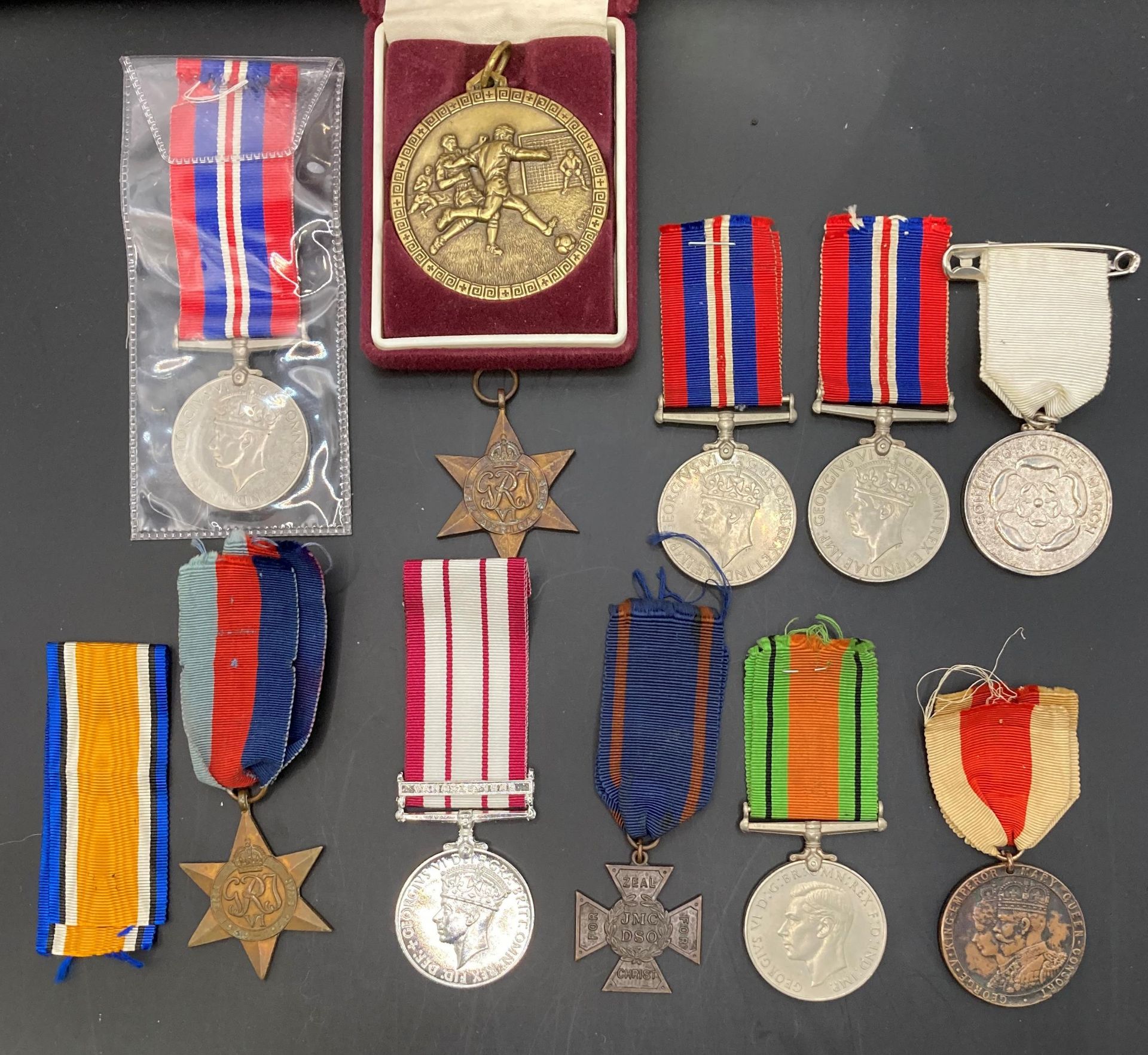Six Second World War Medals - the 1939-1945 Star with ribbon, the Africa Star, two 1939-1945,