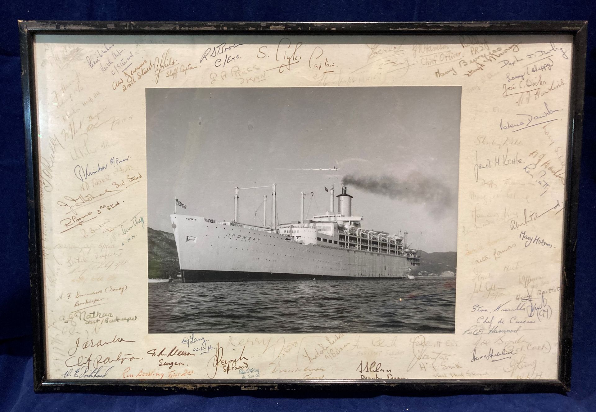 A framed photograph of the ship Oronsay with crew members signatures to the margin (Saleroom