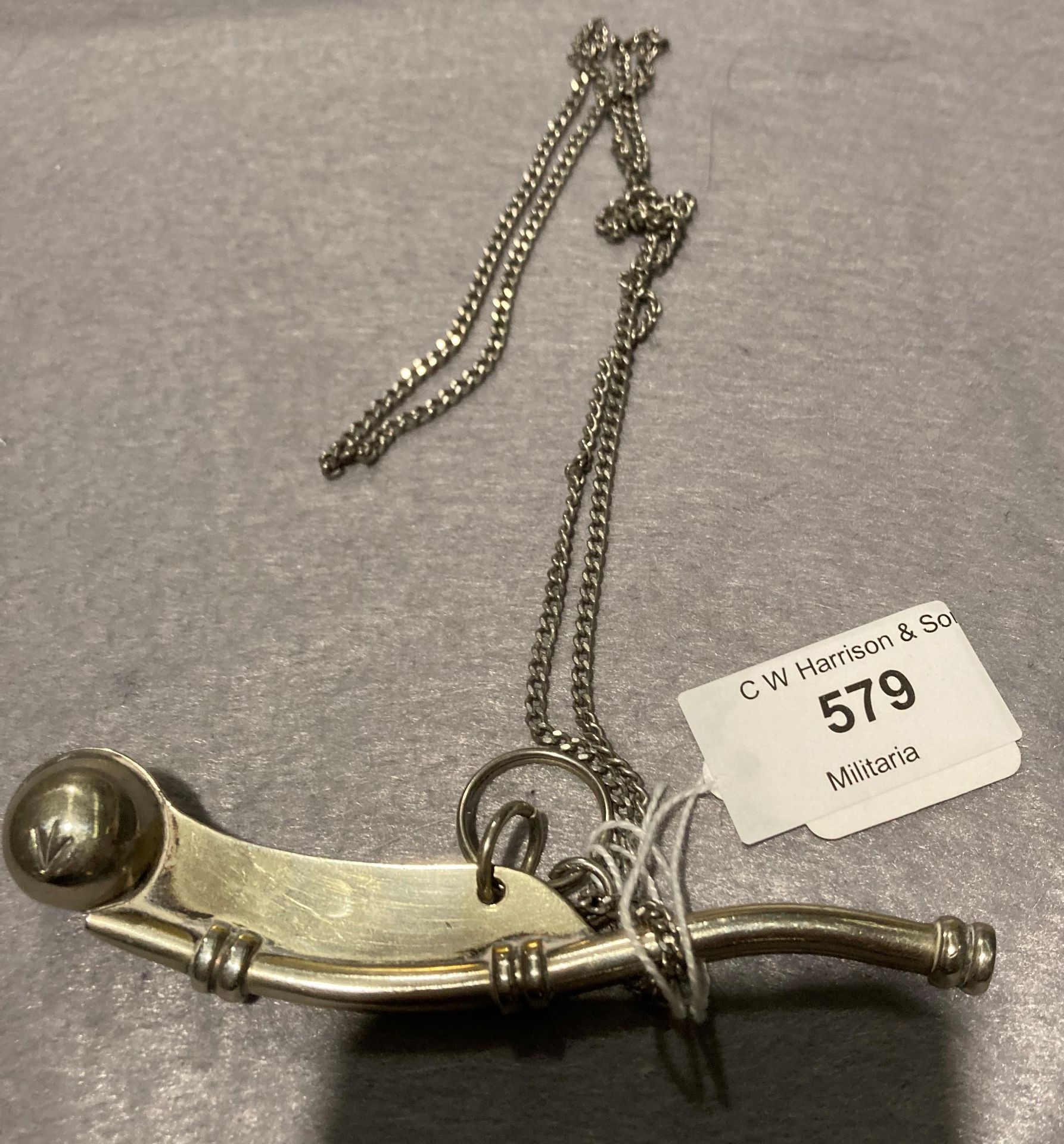 Silver coloured bosun's whistle/boatswain's call on chain (Saleroom location: S3 GC7)
