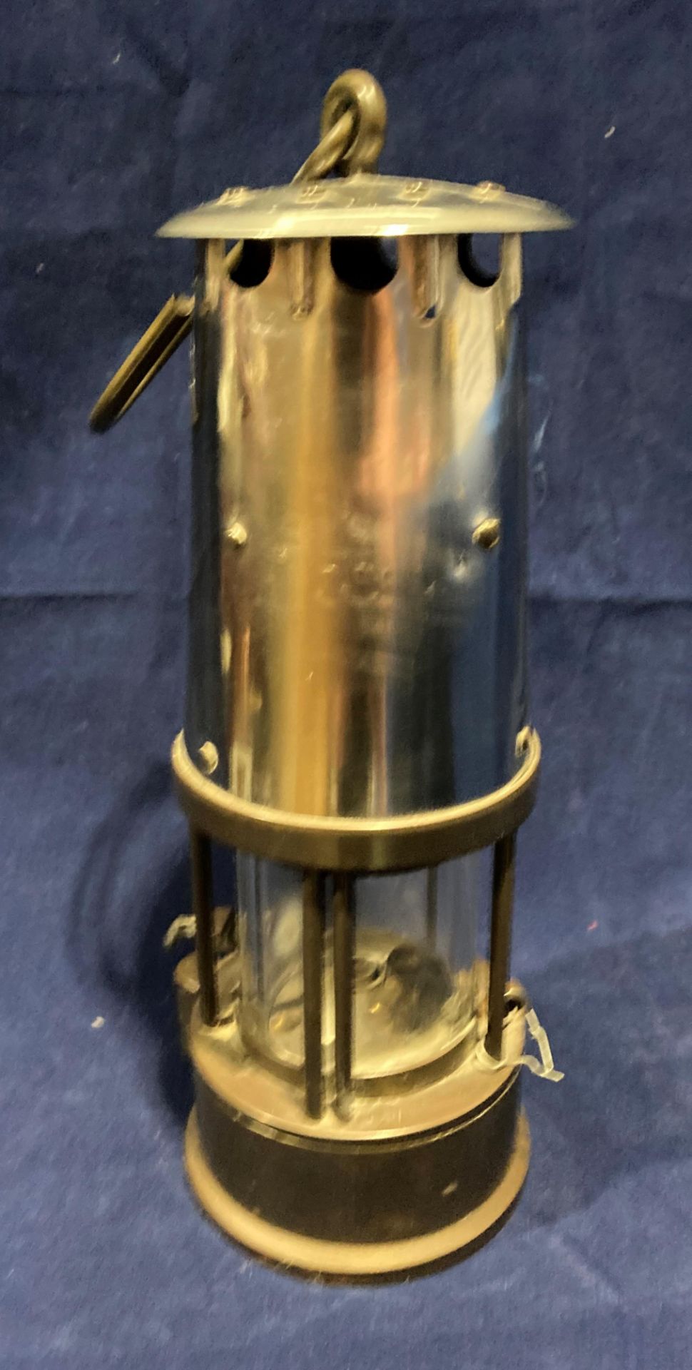 A metal and brass miner's lamp, missing badge,