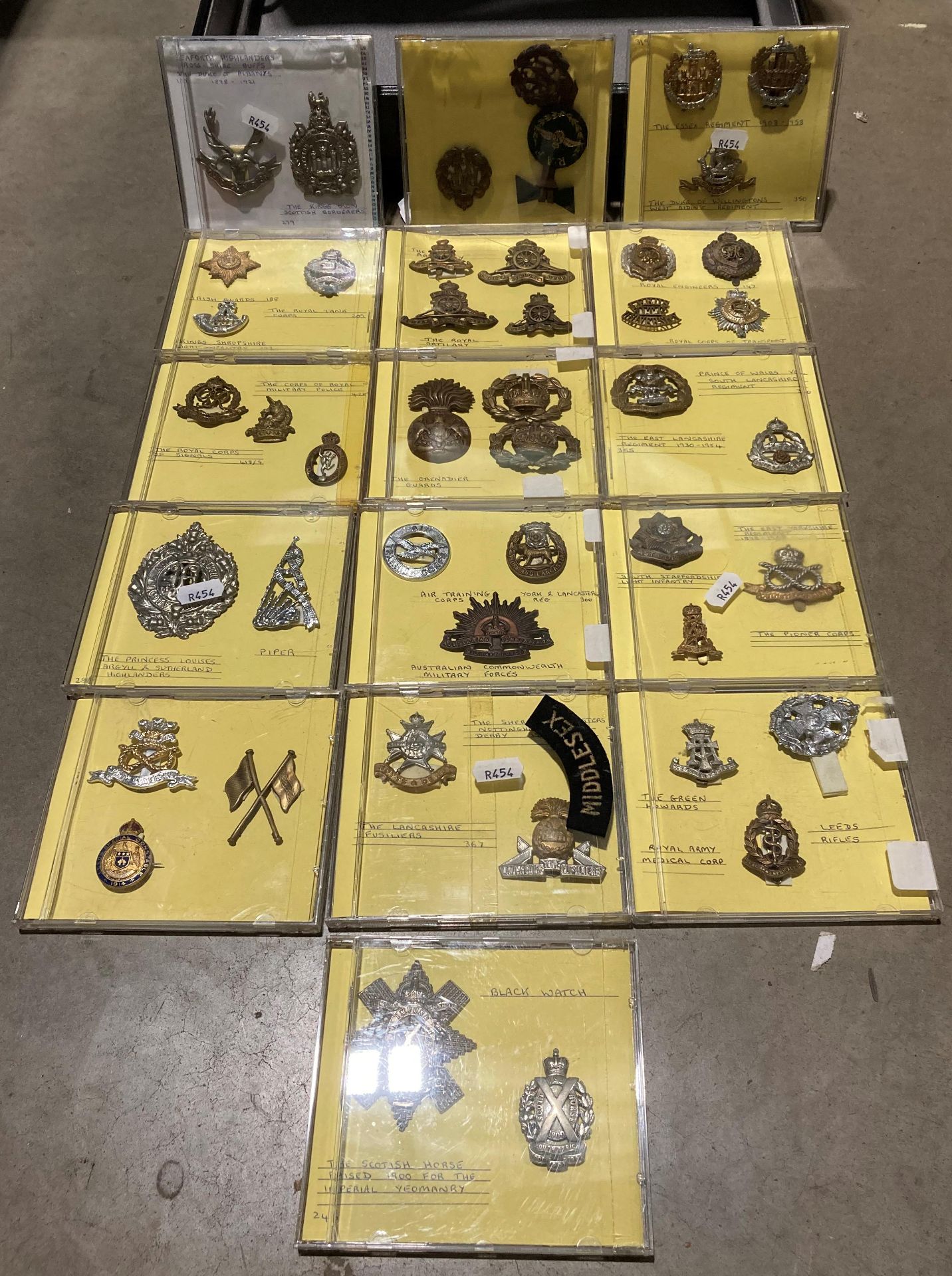 Briefcase and contents - 45 cap badges set in CD cases - mainly British Military and Air Force