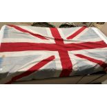 Union Jack flag, faded and pitted and with some small holes,