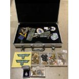 Aluminium case and contents - military and civil defence related badges, cap badges, buttons,