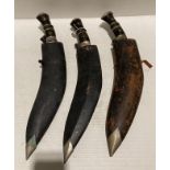 Pair of Gurkha Kukri knives with horn and metal handles,