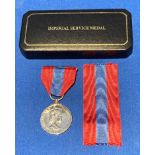 An Imperial Service Medal with ribbon engraved to side Kathleen Smith McGregor,