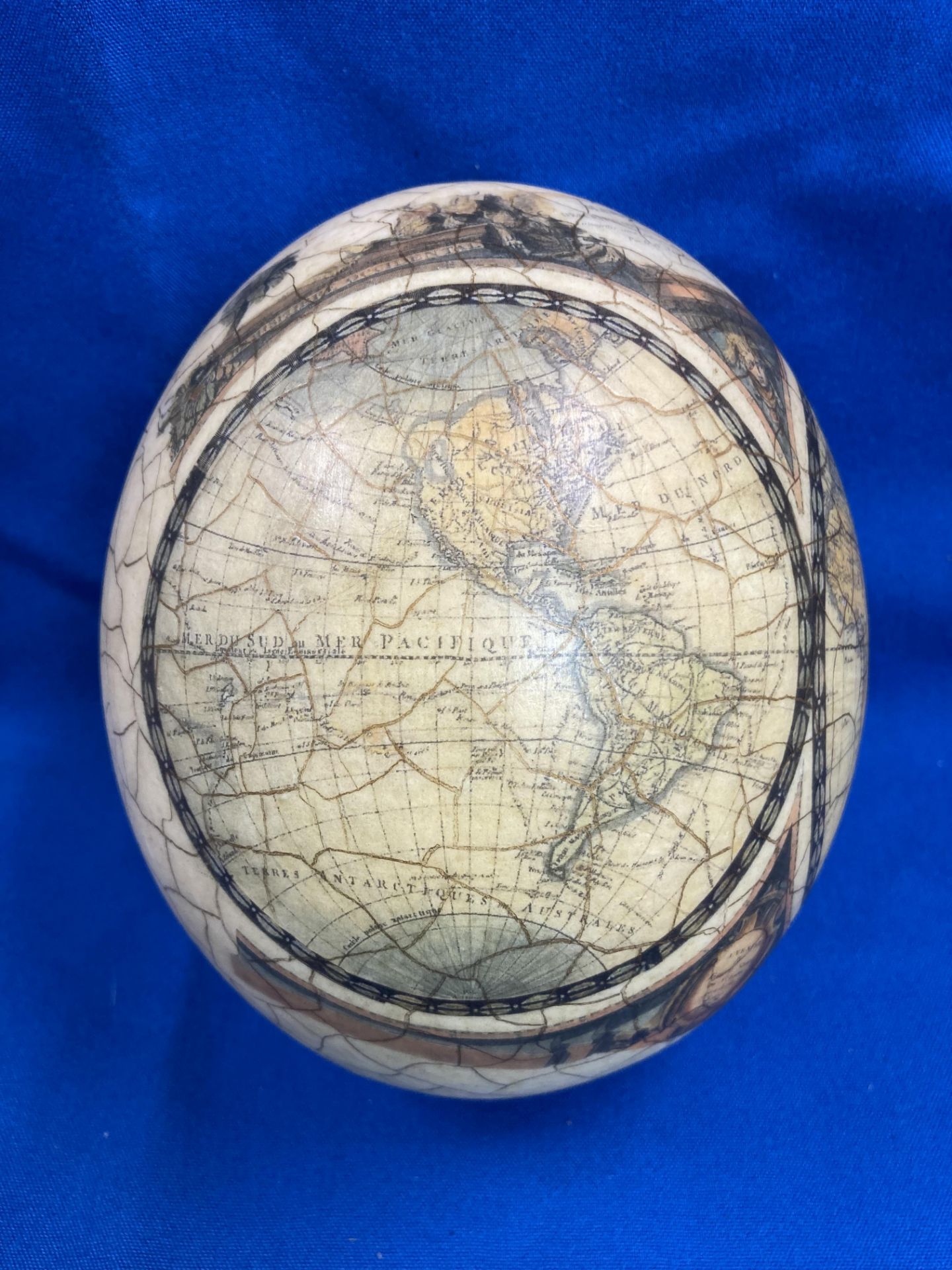 A decorated ostrich egg with World Map and Africa animal scene (approximately 16cm high) with a - Image 6 of 11