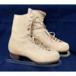 A pair of Fagan Pathfinder ice skating boots in beige,