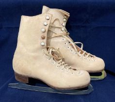 A pair of Fagan Pathfinder ice skating boots in beige,