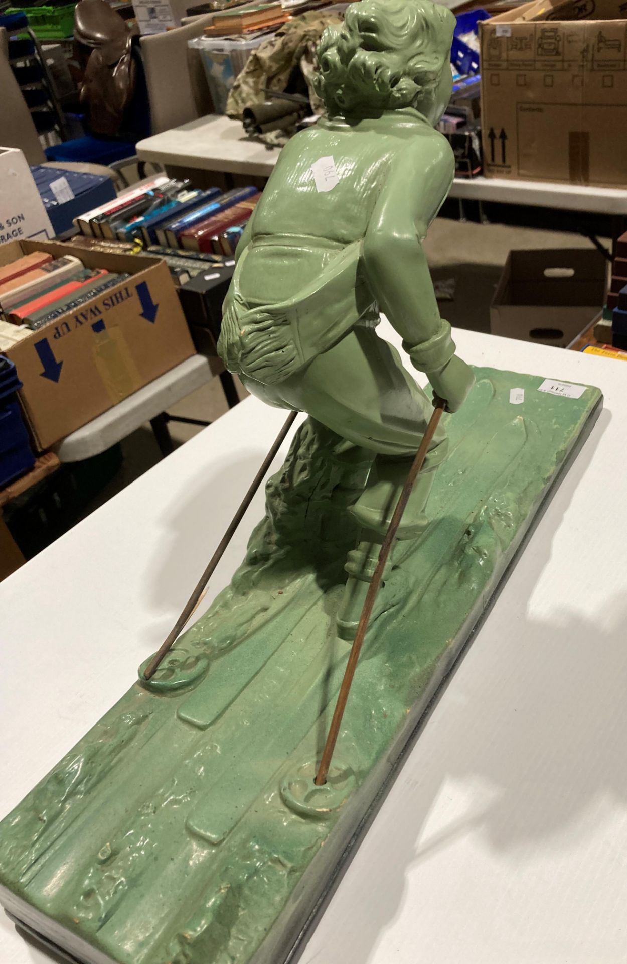 A green plaster sculpture of a female skier reg no: OP 428 RD 833044 on base (one stick broken), - Image 4 of 4