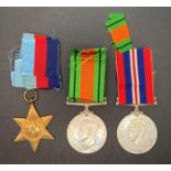 Three Second World War medals - 1939-1945 Defence Medal with ribbon,