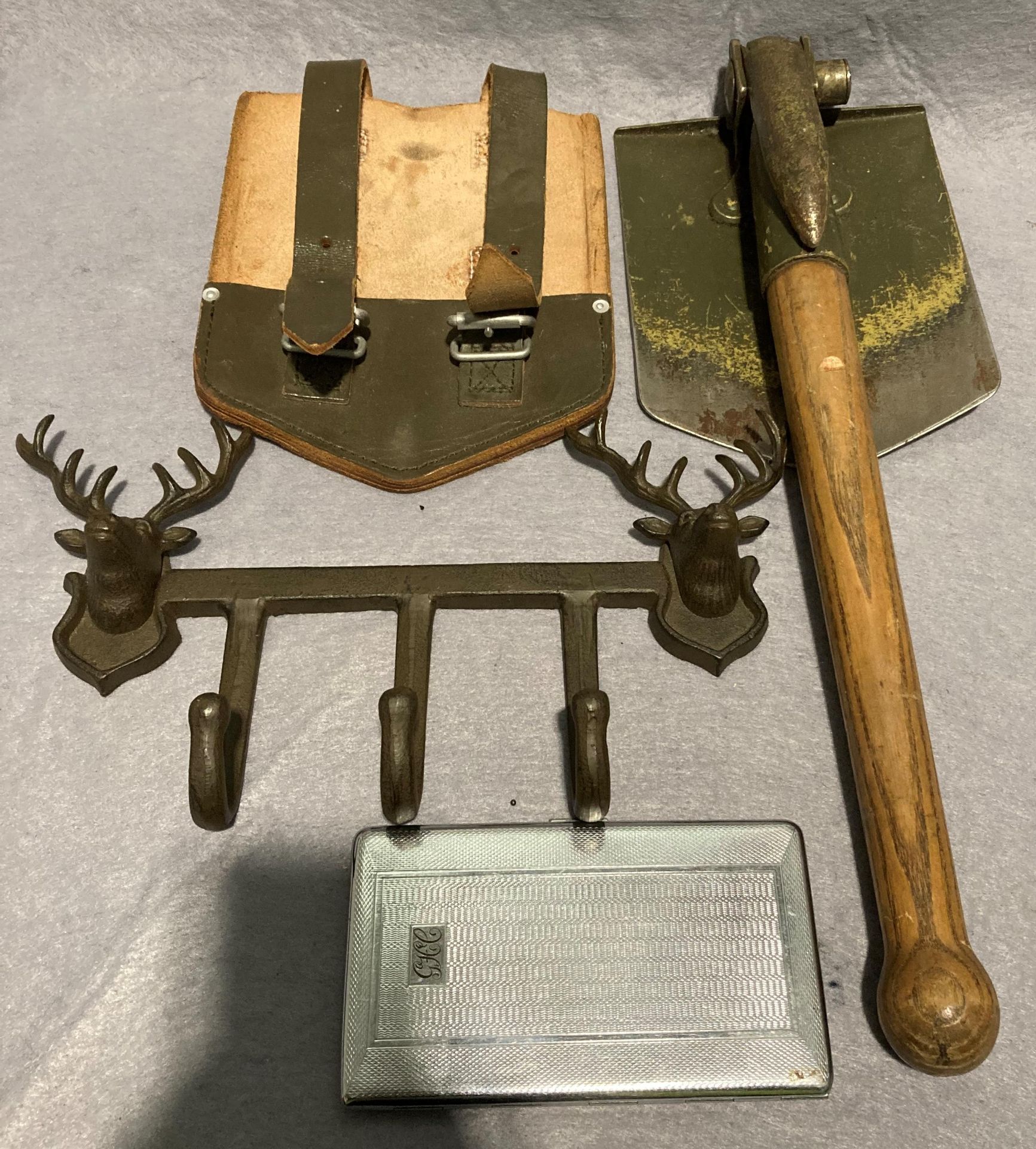 1964 German entrenching tool folding with wooden handle and leather sleeve,