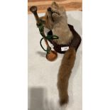 Taxidermy - a foxes head mounted on wooden plaque complete with a foxes tail and a small copper