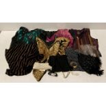 An assortment of vintage clothing - sequin waistcoat and tops in a variety of colours,