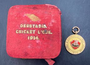 Sir Henry Fowler interest - a 9ct gold medal with red enamel badge Derby and District Cricket