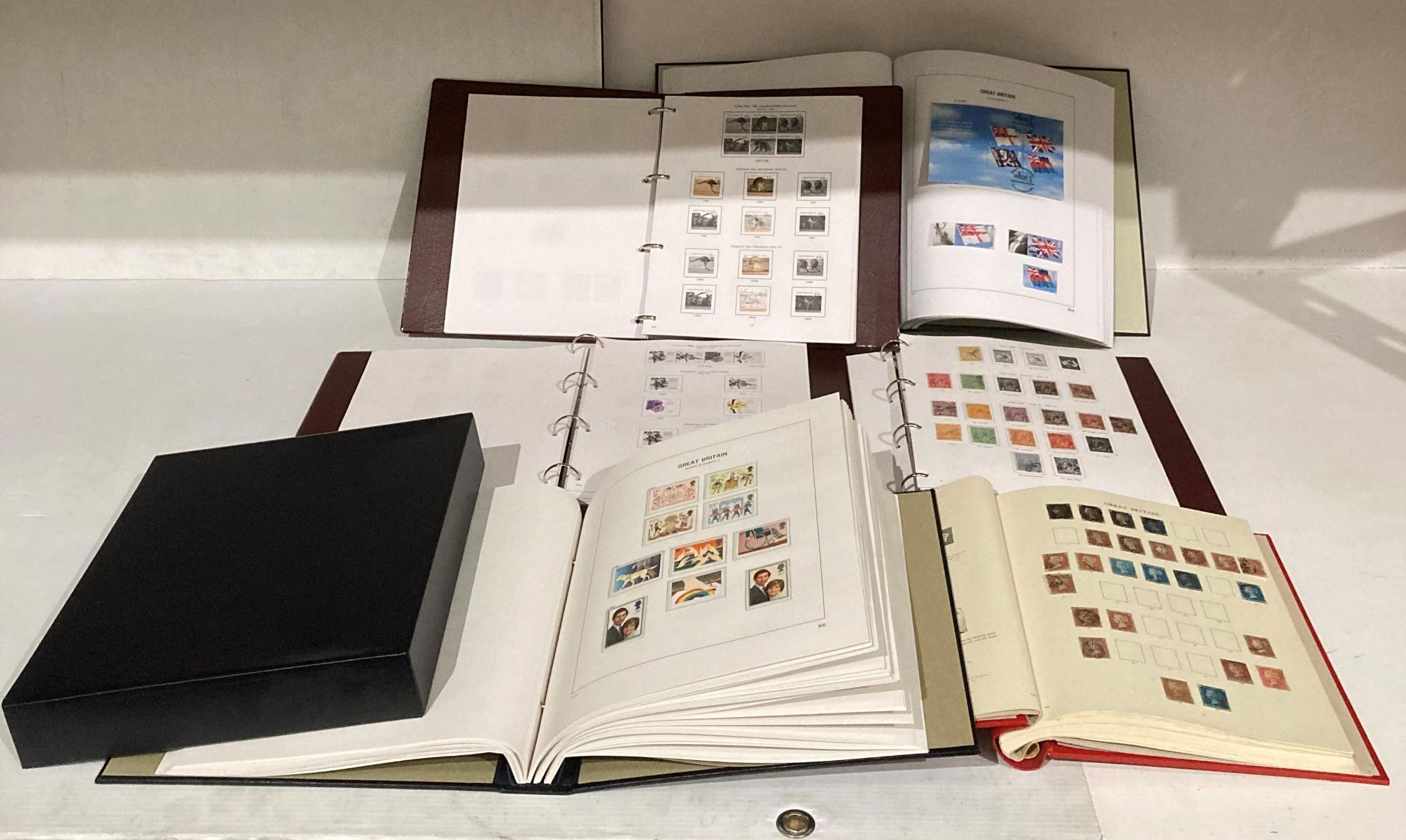 Contents to crate - six Stanley Gibbons stamp albums including three Great Britain and three