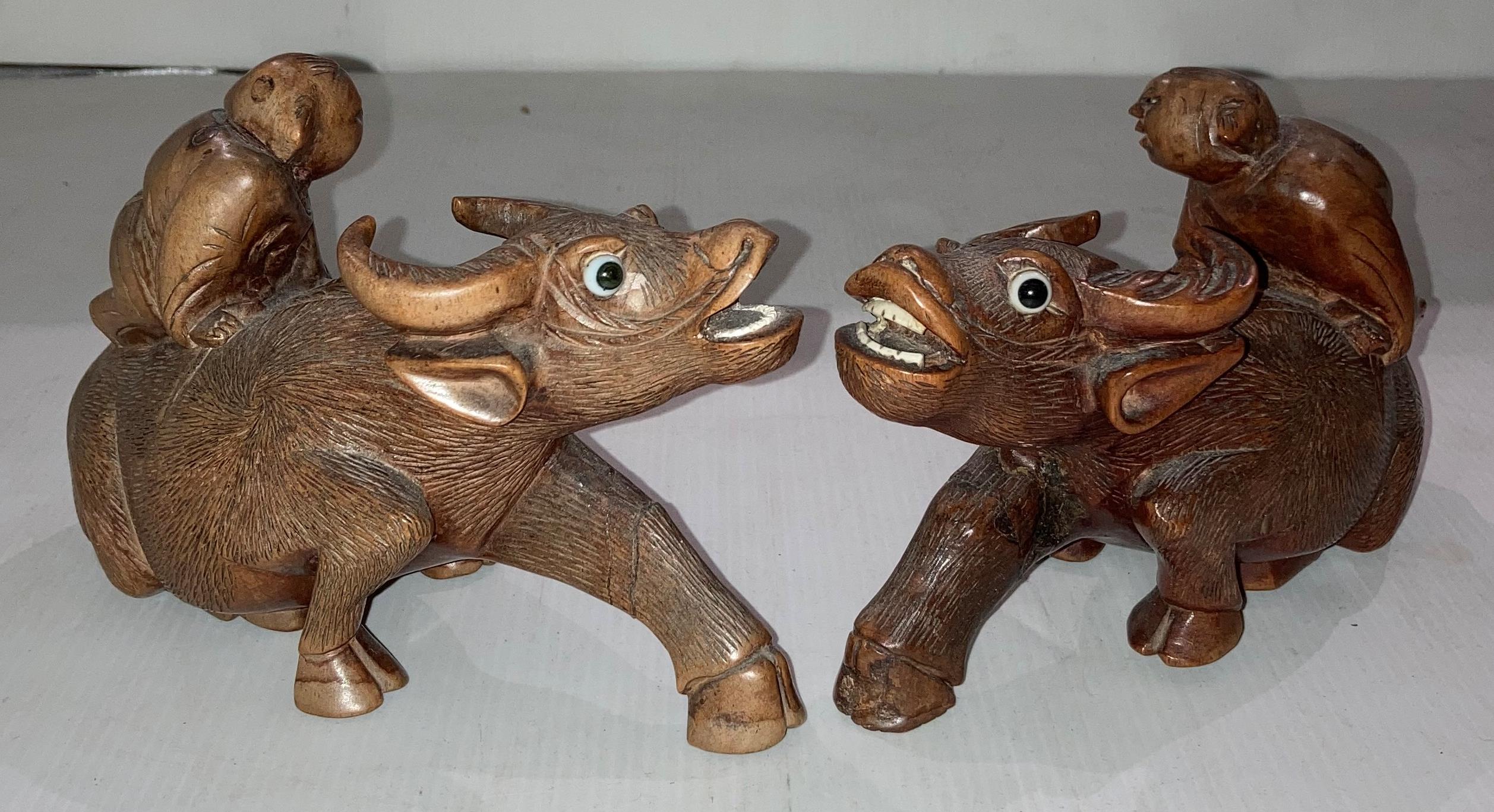 Pair of wooden hand-carved Oriental water buffalo with figures seated, approximately 10. - Image 2 of 4